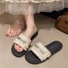 Zapatillas planas versátiles estilo tweed para mujer, para verano, para uso exterior, 2025, nueva moda, francesas, de una línea, con pedrería, zapatillas de playa