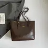 Bolsa Retrô de Grande Capacidade Transfronteiriça para Mulheres 2026 Nova Bolsa de Ombro Casual para o Dia a Dia Bolsa Tote Simples Versátil Texturizada