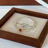 Pulsera Única Estilo Chino de Ágata Roja Natural del Sur con Perlas Shijia Redondas Empalmadas en Cordón Elástico para Mujer, Simple y Sofisticada