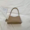 Bolso de mano nicho estilo minimalista coreano para mujer, nuevo de verano 2026, versátil retro para uso diario, bolso casual de hombro y axila