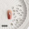 Yiwu mini blanco con forma de diamante de fondo plano diamante mixto de tamaño grande y pequeño en forma de S amor gotas de agua joyería para uñas al por mayor