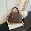 Otoño 2026 Nuevo Bolso de Concha Moda para Mujer Versátil Textura Bolso de Mano Retro Bolso de Hombro Cruzado Bolsos de Mujer al por Mayor