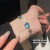¡Joyería de cadena colorida! Pulsera ovalada de circonita súper brillante, sensación de lujo ligero y alta gama, joyería versátil y exquisita para mujer al por mayor