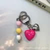 Estilo Ins Bloques de Color Corazón de Caramelo Colgante para Funda de Teléfono Soporte para Tarjetas AirPods Decoración Versátil Creativa Colgante para Bolso de Moda