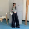 Pantalones de Mezclilla Acampanados Sueltos de Tiro Bajo Estilo Retro Americano 2026 Caída Versátil Otoño/Invierno Cintura Irregular Nuevo Estilo para Mujer