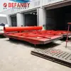 Camión de Plataforma Plana Alimentado por Riel de Bajo Voltaje para Transporte de Cajas de Moldes de Estructura de Acero en Sitio de Fábrica, Camión de Plataforma sobre Rieles de Alta Resistencia de 63 Toneladas