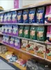 Estanterías de supermercado con veta de madera, estanterías de exhibición multifuncionales para tiendas de conveniencia, papelerías, estanterías metálicas de una y dos caras