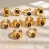 Anillo de acero inoxidable bañado en oro estilo europeo y americano con piedra ojo de tigre, una pieza de joyería lujosa y de alta gama con piedra ojo de tigre natural y acero de titanio, diseñado para ser duradero y resistente a la decoloración