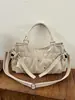 Bolso bandolera europeo y americano retro de gran capacidad con tachuelas, nuevo estilo coreano simple casual para hombro o axila, principios de otoño 2026