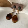 Brincos de Resina Geométrica Florais Cruzados Europeus e Americanos Outono e Inverno Maillard Studs de Orelha Design de Nicho de Alta Qualidade Joias de Orelha Atacado