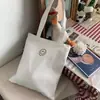 Diseño original coreano estilo perezoso ins bolso de mano para llevar al hombro estudiantes universitarios clase bolsa de lona mochila mujer