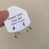 Aretes colgantes de estrella de cuatro puntas para mujer, Lujo accesible, Diseño de nicho, Aretes de alta gama, Elegantes, Aretes de estilo cool