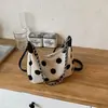Bolso de axila de lunares de nicho coreano de moda para mujer, bolso versátil de lona, nuevo bolso elegante y sencillo para el hombro y cruzado 2026
