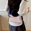 Nova bolsa de mão estilo coreano com bolinhas para mulheres em 2026, apresentando um design minimalista e único, versátil para o dia a dia, e pode ser usada como bolsa de ombro ou bolsa transversal