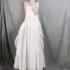 Saia-macacão feminina de algodão e linho estilo novo de verão bainha irregular artística plissada cor sólida sem mangas vestido de linho