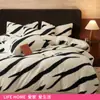 Conjunto de Quatro Peças de Cama de Veludo Leite Quente e Espesso de Inverno 2025 Novo Conjunto de Três Peças de Lençóis e Capa de Edredom de Veludo Coral