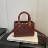 Nuevo modelo de otoño temprano 2026, bolso de mano sencillo con patrón de diamantes para mujer, bolso cruzado de moda con textura, bolso de hombro, bolsos de mujer al por mayor