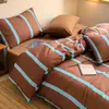 Set de Cuatro Piezas de Algodón Lavado Estilo Nuevo 2026 Sábana Nórdica y Funda de Edredón para Estudiantes de Dormitorio en la Temporada de Regreso a Clases, Lavable a Máquina