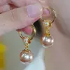 Pendientes circulares de perlas color champán con diseño de celebridades de Internet para mujer, ligeros, elegantes, de alta gama, con hebilla para oreja, ajustados y combinables.