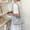 Bolso de lona a rayas de nicho para mujer 2026 nuevo casual elegante de gran capacidad bandolera de moda bolso tote de moda