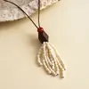 Collar de cordón de cuero retro europeo y americano, resina de madera, borla geométrica redonda, una cadena única y elegante para suéteres, perfecto para ventas transfronterizas