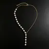Collar asimétrico de perlas artificiales para mujer, nuevo diseño de nicho europeo y americano para primavera y verano, joyería sexy para combinar con vestidos, forma de Y
