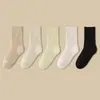 Calcetines para mujer engrosados con forro de felpa calcetines de rizo calcetines de tubo cálidos de invierno absorbentes de sudor transpirables color liso calcetines con base de toalla moda