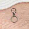 Set de Tres Piezas de Dijes para Bolsa con Broche de Langosta de Aleación de Zinc 308 Chapado, Llavero de Figura de Ocho y Pequeño Colgante del Festival Qixi