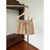 Saia casual de cintura elástica e corte solto para mulheres, novo estilo de verão, versátil, com cordão, anti-exposição, curta em A.