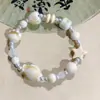 Fabricantes suministro pulsera de cachorros de cerámica diseño de nicho pulsera nuevo chino lindo cachorros huesos cuentas juguetonas