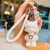 Llavero de Muñeco Oso de Moda con Cordón de Cuero Trenzado y Orejas de Gato de Resina, Adecuado para Niños, Estudiantes, Colgantes para Mochila, Regalos para Niños
