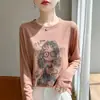 Nuevo suéter de punto fino de cuello redondo y manga larga para mujer, entrecruces, principios de otoño 2025, jersey holgado estampado para niñas, camiseta básica
