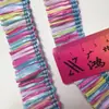 Venta directa de fábrica de accesorios de encaje trenzado con borlas de hierba de PP en stock para decoración de bolsos, accesorios de decoración para faldas de encaje