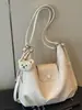 Mochila de viaje para commuting de gran capacidad, nuevo estilo verano 2026, bolso de hombro personalizado, bolso liso para mujer de alta apariencia