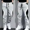 Pantalones deportivos para hombre de moda transfronterizos estilo americano, colección otoño/invierno, diseño de retazos, tobillo cónico, pantalones largos holgados, pantalones casuales