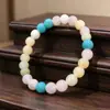 Pulsera de mujer de diseño de nicho moderno con tacto de alta gama, pulsera de cuentas de cristal de jade, pulsera de cuentas redondas de 8 mm de colores dopamina para la mano