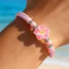 Pulseira Ajustável de Corda Tecida com Contas Redondas de Cerâmica Suave Plumeria Estilo Havaiano Versátil Boêmio Europeu e Americano