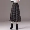 Falda de moda a cuadros para otoño e invierno para mujer, nueva falda de línea A adelgazante de cintura alta 2026, corte ajustado, falda fluida de longitud media