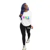 D9405 Venta caliente en Amazon moda casual para mujer europea y americana patrón liso estampado conjunto de dos piezas de pantalones largos