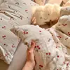 Juego de tres piezas de hilo de algodón de doble capa estilo Ins Una funda de almohada floral de gasa de algodón puro respetuosa con la piel un par de sábanas de color sólido