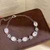 ¡Mar de Glamour en tu Muñeca! Pulsera de lazo ovalado de circón europeo y americano, sensación de lujo ligero y alta gama, joyería de nicho de moda