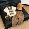 Estilo Coreano Niños Verano 2026 Nuevo Bloque de Color Retro Patrón de Diamantes Cuello Polo Tejido Traje Casual Infantil Pantalones Largos