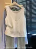 Estilo Old Money Nuevo Diseño Cuello Redondo Sin Mangas Falso Dos Piezas Ganchillo Hueco Camiseta de Punto de Tencel Lino para Mujer 12503