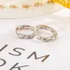 Bestseller transfronterizo: Pendientes Mobius con incrustaciones de circonita para mujer, estilo coreano sencillo, pendientes retorcidos únicos, accesorios para la oreja modernos y únicos