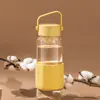 Chá resistente a altas temperaturas é separado por chá e água copo de água portátil anti-queimadura copo de vidro de alto nível copo portátil para fora de casa