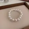 Pulsera elástica de perlas simple retro francesa Pulsera de moda de lujo ligero francesa Pulsera de temperamento versátil para el día a día venta al por mayor