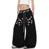 Pantalones de chándal retro americanos con estampado de letras y estrellas, pierna curva, unisex, nueva colección primavera/otoño 2026, corte holgado, versátiles pantalones negros de pierna ancha