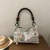 2026 Verano Nuevo Estilo Nacional Bolso Tote Moda Femenina Borla Alto Nivel Sensación Hombro Único Versátil para Viaje de Negocios al Trabajo al por Mayor Bolso de Mujer