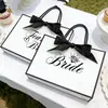 Bolsa de regalo de boda exclusiva transfronteriza para el Equipo de la Novia con lazo de cinta blanco y negro, bolsa de mano para fiesta