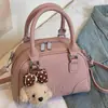 Bolsa de almohada transfronteriza para mujer 2026 Nuevo estilo Moda Popular Temperamento Bolsa de boliche Elegante Bolso de mano para hombro Cruzado Moderno